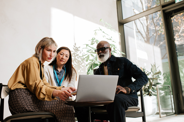 people talking at meeting table image